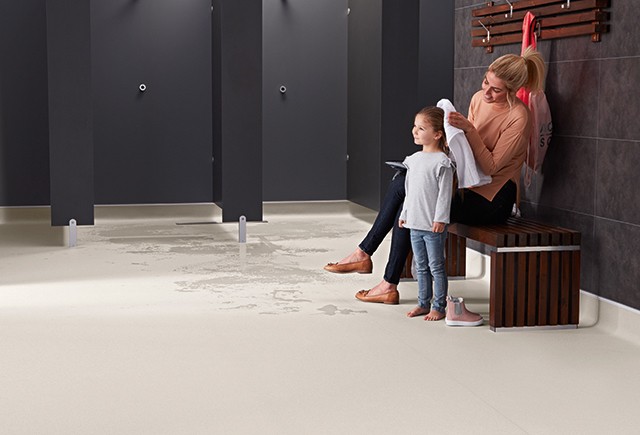 Safety flooring in a locker room | Markville Carpet & Flooring