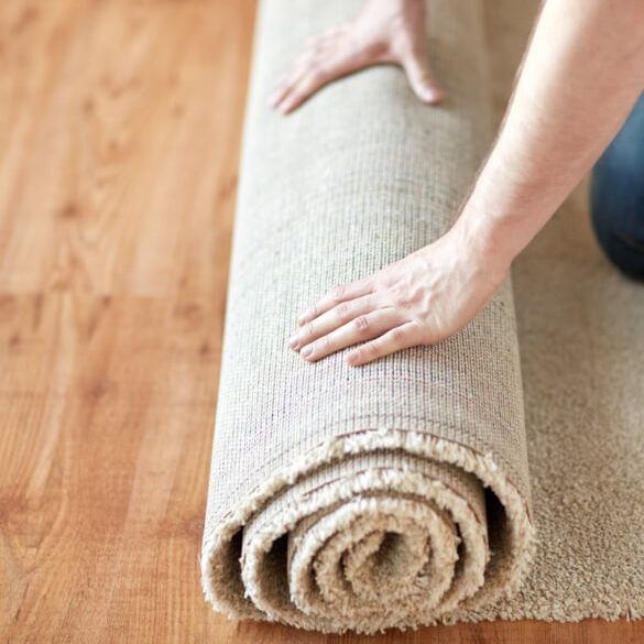 Carpet rolling by man | Markville Carpet & Flooring