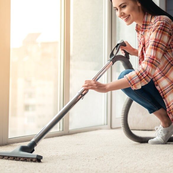 Vacuuming carpet | Markville Carpet & Flooring