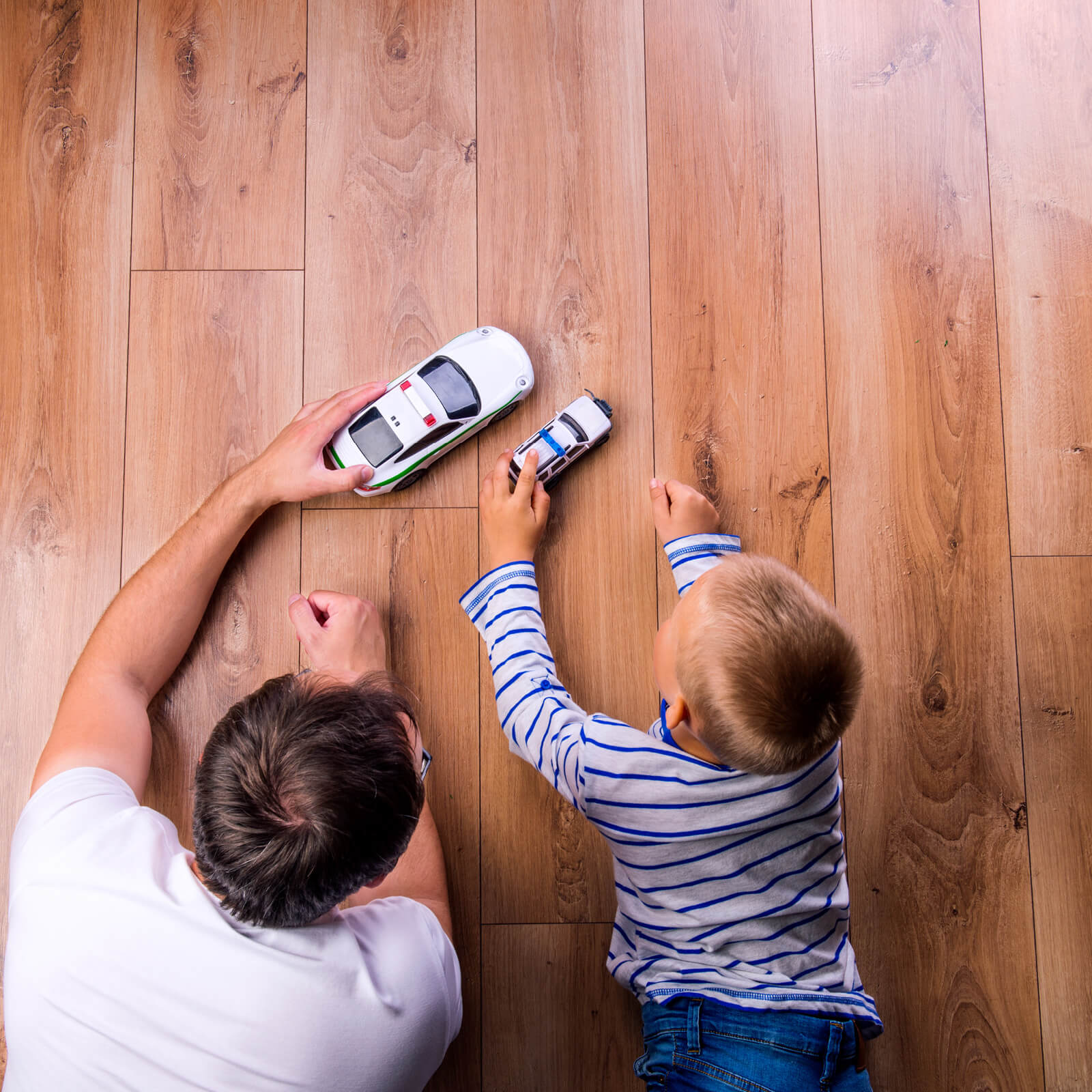 Dad and child on hardwood flooring | Markville Carpet & Flooring