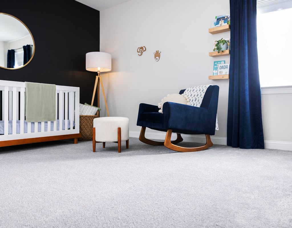 Carpet flooring with blue couch | Markville Carpet & Flooring