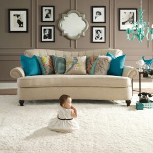 Cute baby sitting on carpet flooring | Markville Carpet & Flooring