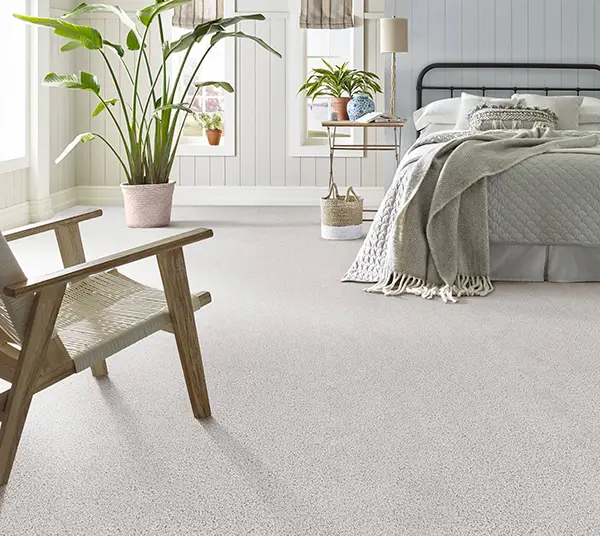 Light colored carpet in brightly lit contemporary bedroom | Markville Carpet & Flooring