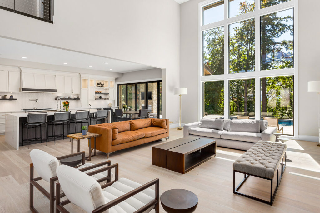 Luxury laminate flooring in a large living room with high ceiling by Markville in Markham, ON & Toronto, Ontario.